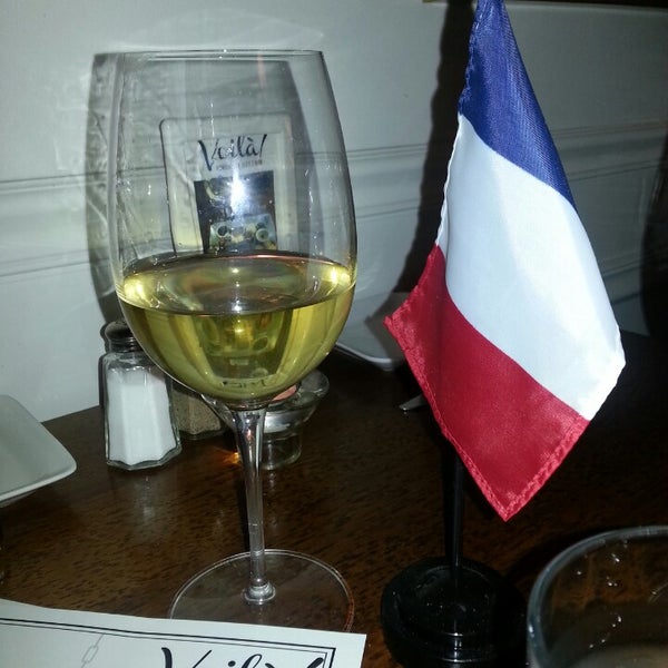 Photo taken at Voila! French Bistro and Wine Bar by Kris B. on 9/22/2013