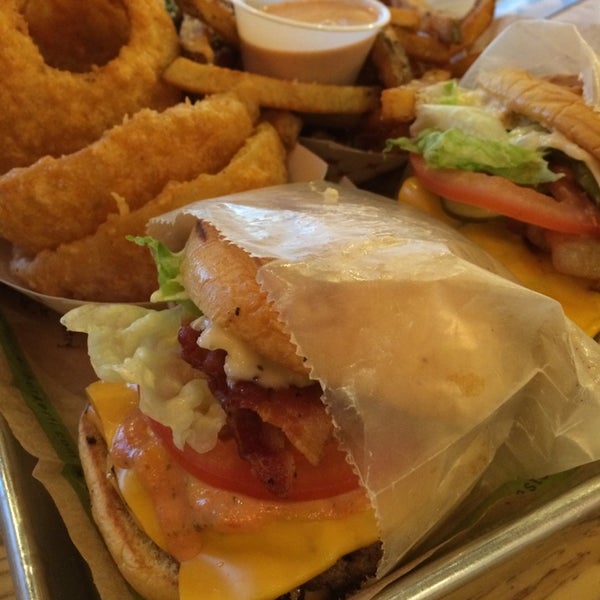 Photo taken at BurgerFi by J B. on 3/21/2014