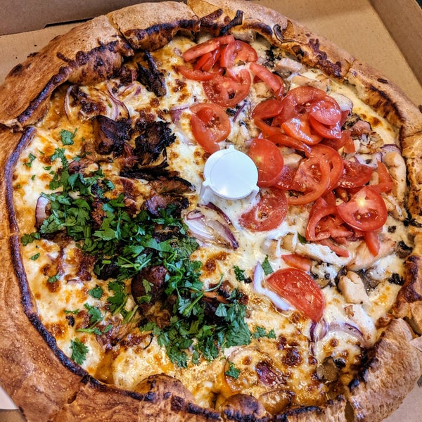 Foto diambil di Woodstock&#39;s Pizza oleh tabasaur pada 7/21/2019