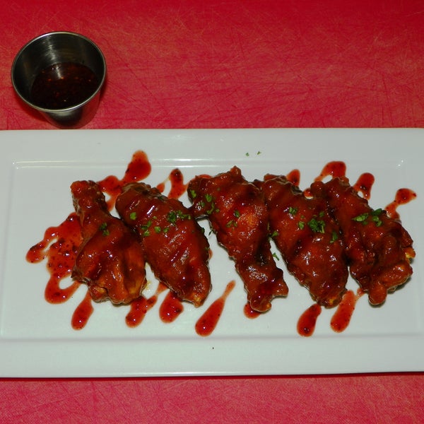 Peanut Butter and Jelly Wings!!!  A twist on a old favorite...5 wings tossed in a peanut thai sauce drizzled with roasted jalapeno strawberry jam.  Awesome!!!