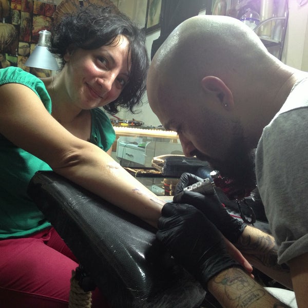 Photo taken at Tattoomix by irem y. on 5/18/2013