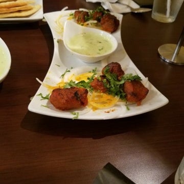 Photo taken at Cilantro Indian Cafe by Happyfeet on 5/24/2018