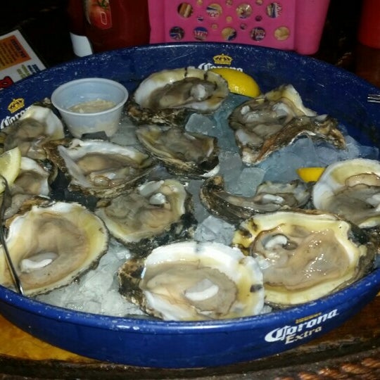 Photo taken at Bimini&#39;s Oyster Bar and Seafood Cafe by Lindsay B. on 8/22/2015