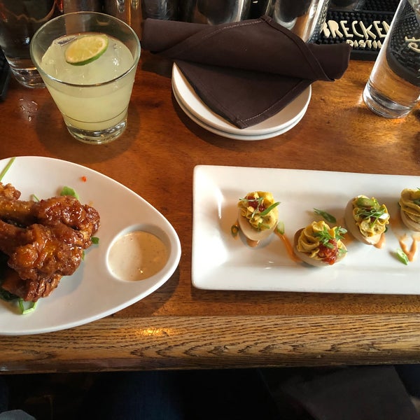 Get the crispy duck wings! Great cocktails and happy hour deals too.