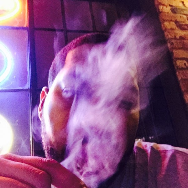 Photo taken at Elite Cigar Cafe by Michael B. on 10/31/2014