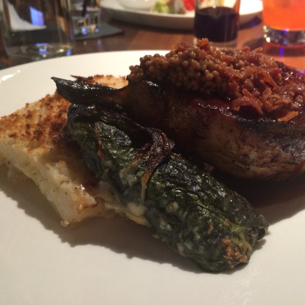 Bacon Apple Pork Chops with braised Swiss chard and potato pave