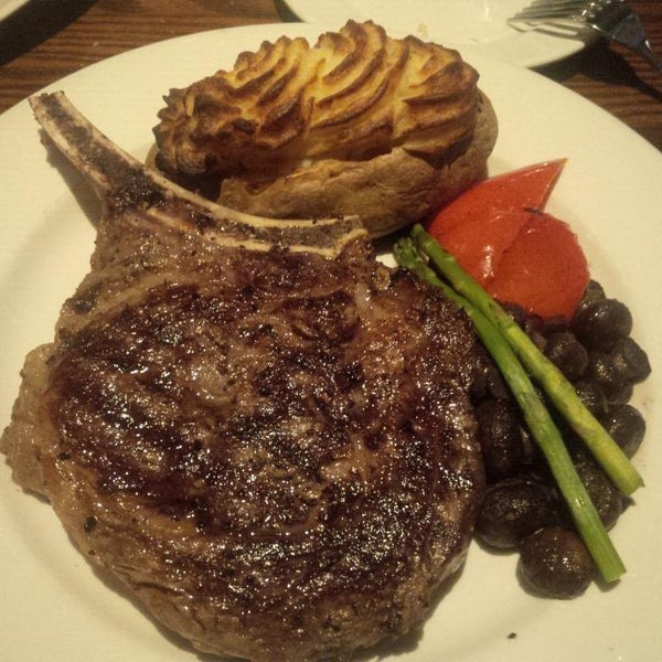 Photo taken at The Keg Steakhouse + Bar - Windsor Riverside by Jason C. on 11/14/2013