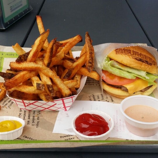 Photo taken at BurgerFi by Cool S. on 10/1/2014