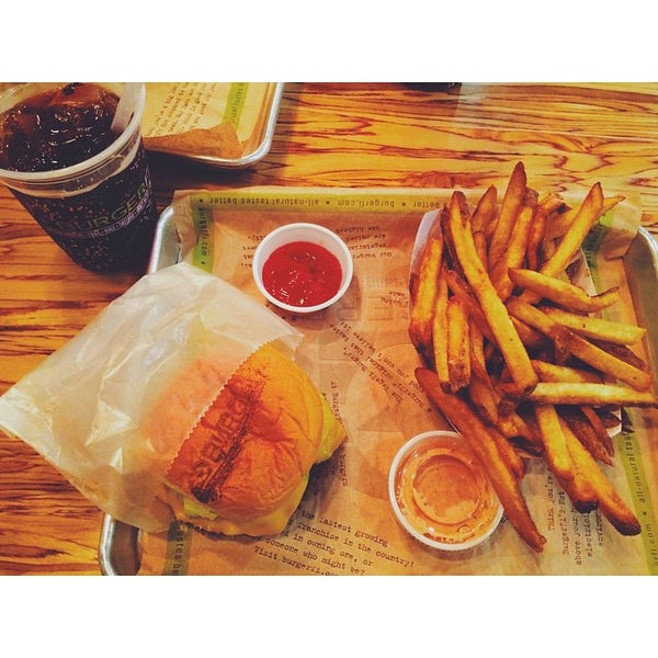 Photo taken at BurgerFi by Alex M. on 10/3/2014