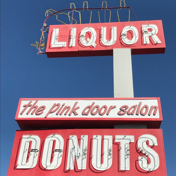 Star Keg Liquor on Garden Grove Blvd in Garden Grove, CA. The liquor bottles on the sign are animated at night to look like the bottle is being poured.