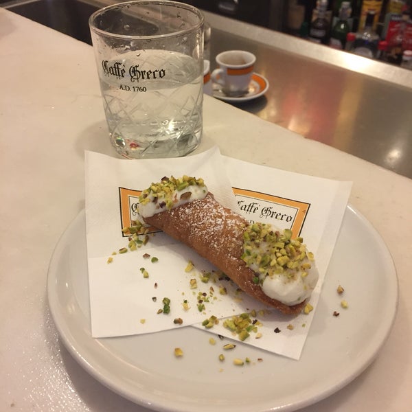 Must have a cannoli piped with fresh pistachio ricotta, alongside your cafe.