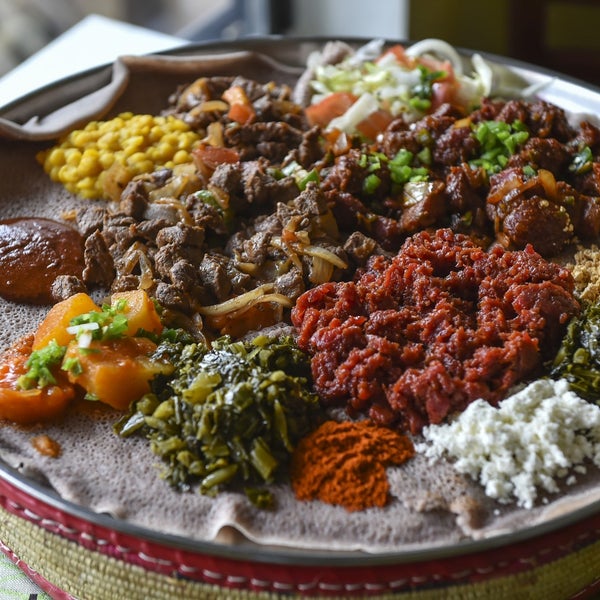 You may need to press your server to receive an authentic Ethio­pian experience, but your pushiness will be rewarded. Try it by ordering the kitfo raw.