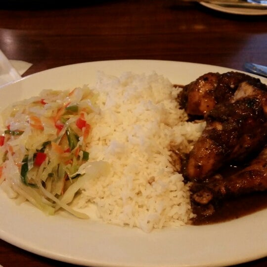Photo taken at Jamaica Gates Caribbean Restaurant by Ebony on 6/22/2014