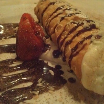 Photo taken at Scuzzi&#39;s Italian Restaurant by Brianna C. on 1/2/2012