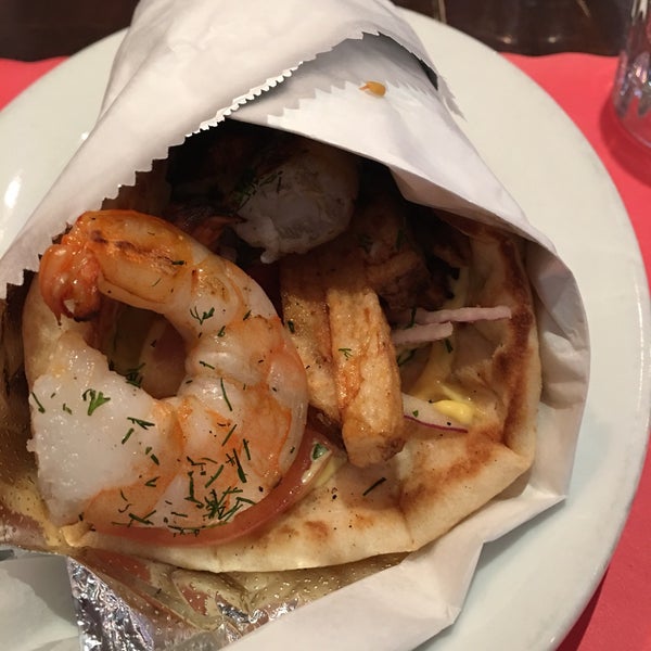 Great shrimp pita /souvlaki with fries, red onions and mustard mayo!