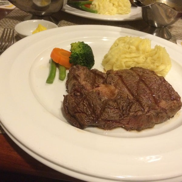 Photo taken at Amigo Grill &amp; Restaurant by Yoshihiro Y. on 5/2/2014