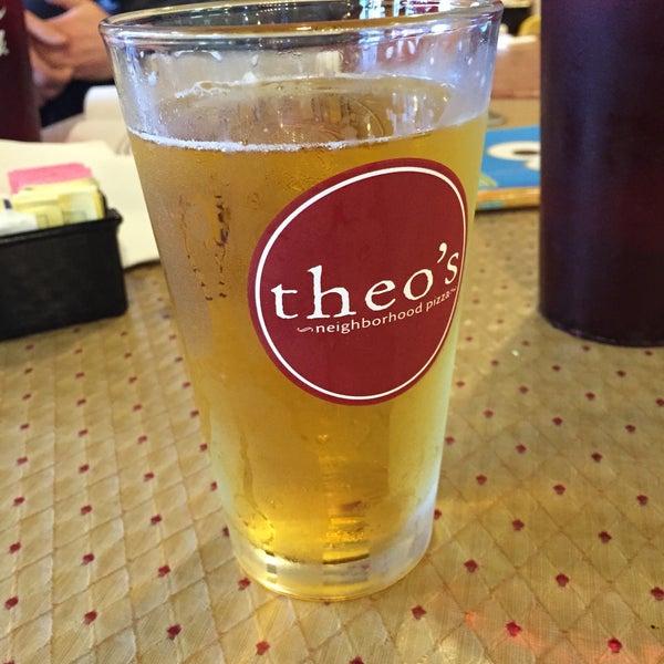 Photo taken at Theo&#39;s Neighborhood Pizza by Katie B. on 1/11/2015