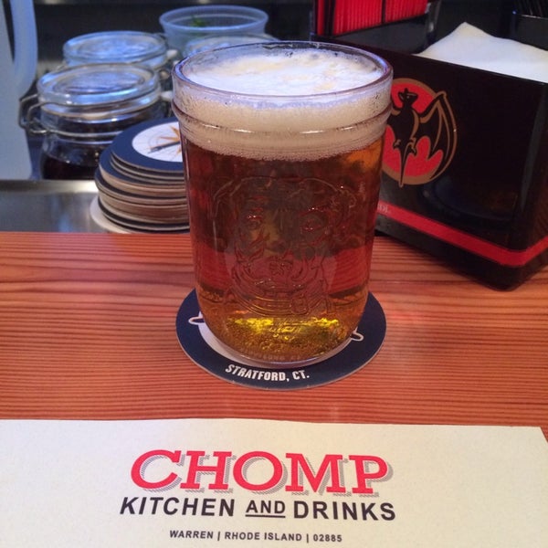 Photo taken at Chomp Kitchen and Drinks by Chris D. on 12/8/2013