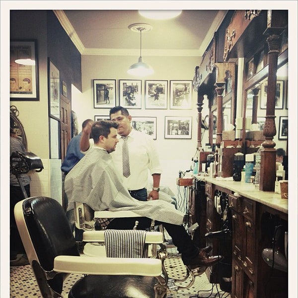 Photo taken at Neighborhood Cut and Shave Barber Shop by Alex N. on 9/18/2012