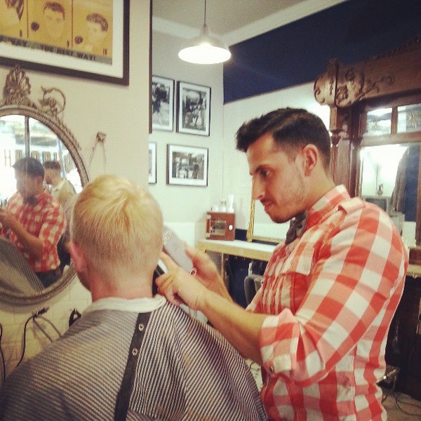 Photo taken at Neighborhood Cut and Shave Barber Shop by Alex N. on 4/4/2013