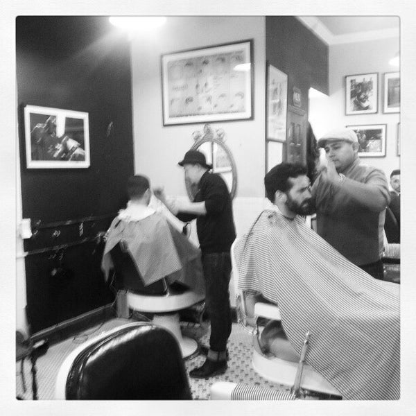 Photo taken at Neighborhood Cut and Shave Barber Shop by Alex N. on 2/6/2013