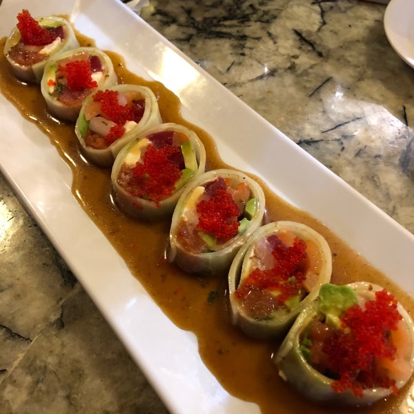 Photo taken at Eurasia Sushi Bar &amp; Seafood by Martin G. on 12/31/2019