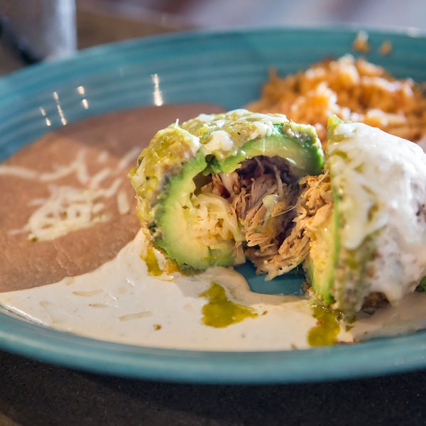 Everybody raves about our stuffed avocados! Lightly battered and fried, filled with spicy chicken and gooey cheese, topped with suiza sauce...YUM!