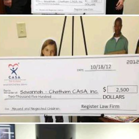 $2,500 donation from the Register Law Firm to Savannah Chatham CASA!