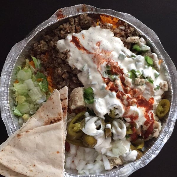 Photo taken at The Halal Guys by Neil F. on 8/29/2015