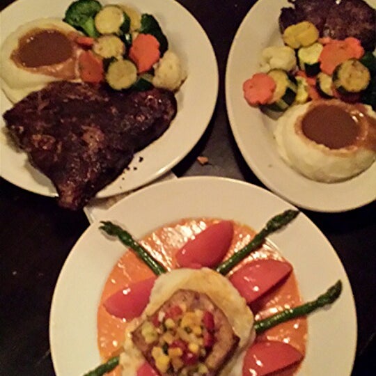 Photo taken at Stubrik&#39;s Steakhouse by Kevin T. on 3/9/2014