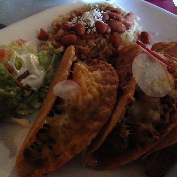 Photo taken at Quetzalcoatl Fine Mexican Cuisine and Bar by Faith on 7/15/2013