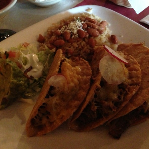 Photo taken at Quetzalcoatl Fine Mexican Cuisine and Bar by Faith on 7/15/2013