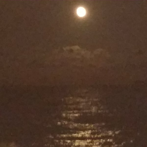 The full moon over the Atlantic Ocean