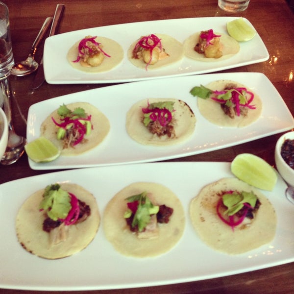 The trio of pork belly, fish , & duck confit tacos are out of this world.