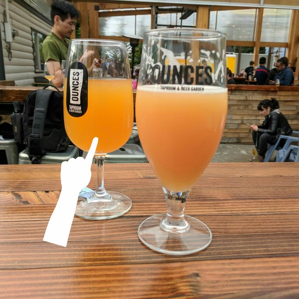 Photo taken at Ounces Taproom &amp; Beer Garden by Jake on 5/18/2018