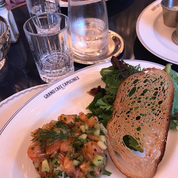 Photo taken at Le Grand Café Capucines by Albina L. on 8/19/2019