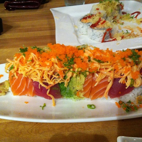 Photo taken at Sushi Ichimoto by Emily M. on 3/22/2013