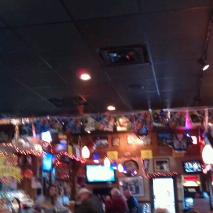 Photo taken at Mulligans Bar &amp; Grill by June T. on 11/18/2012