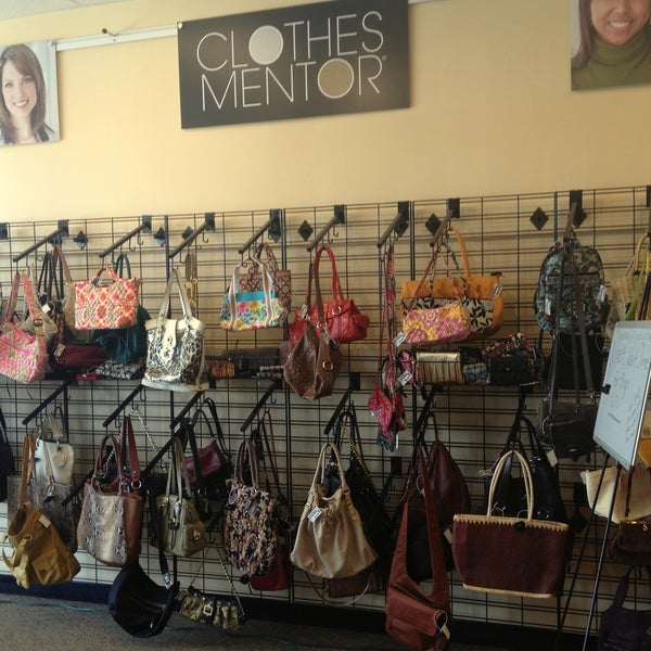 These are some of the designer handbags we're selling at Clothes Mentor. We have two walls full of handbags including brands like Vera Bradley, Coach, DNKY, and more!