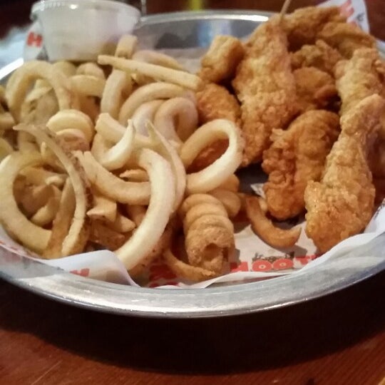 Photo taken at Hooters by Henry G. on 5/1/2014