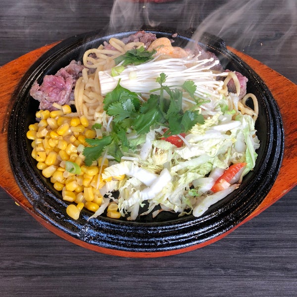 Vietnamese influences sizzling plates! Beef garlic noodles were good
