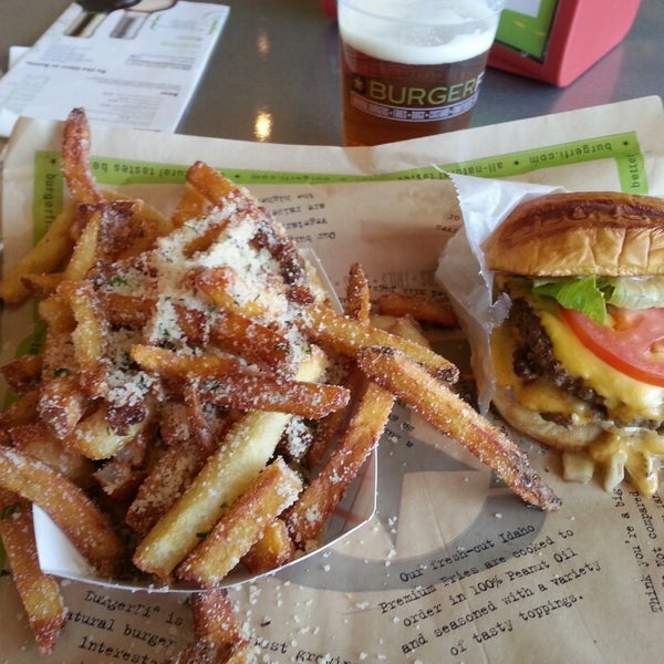 Photo taken at BurgerFi by Johnny E. on 4/7/2014