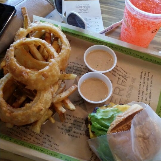 Photo taken at BurgerFi by Vic D. on 6/8/2014