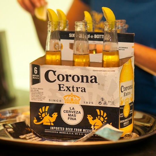 Buy your sixpack Corona €18 and win summer items!