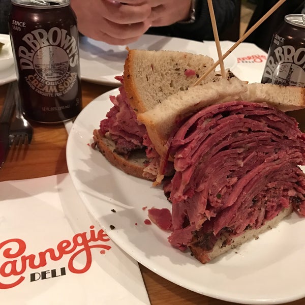 Photo taken at Carnegie Deli by Mónica C. on 11/23/2016