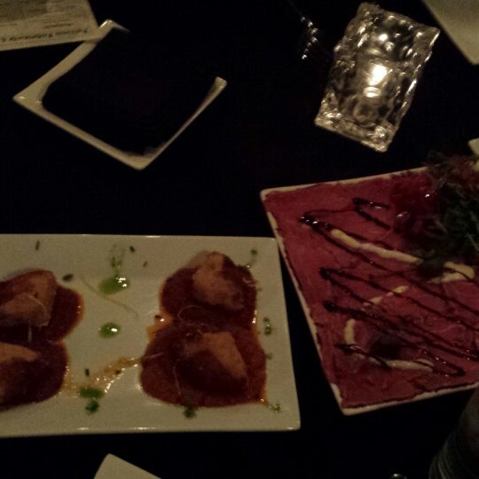 Photo taken at Bellini&#39;s Ristorante &amp; Bar by Wade O. on 2/9/2014