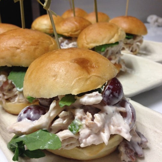 Chicken salad slider with bacon, green onion, pecans and red grapes.