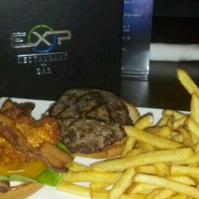 Photo taken at EXP Restaurant + Bar by Joel R. on 1/28/2013