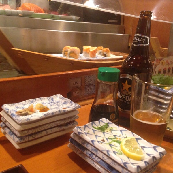 Photo taken at Sushi Boat by Evan on 4/6/2015