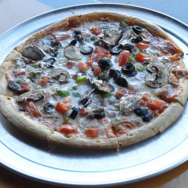 Try the Veggie Pizza! We have yet to find a restaurant (besides Imo's of course) that does the classic St. Louis pizza any better. Provel for the win! http://bit.ly/1cp9WrR